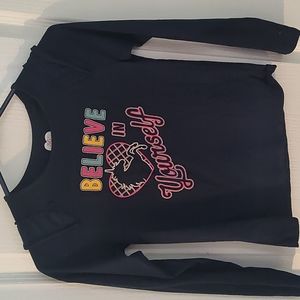 Dark blue long sleeve with unicorn print Infront of the top for girls.